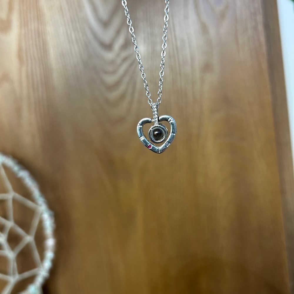 Heart necklace look inside says I love you in every language.